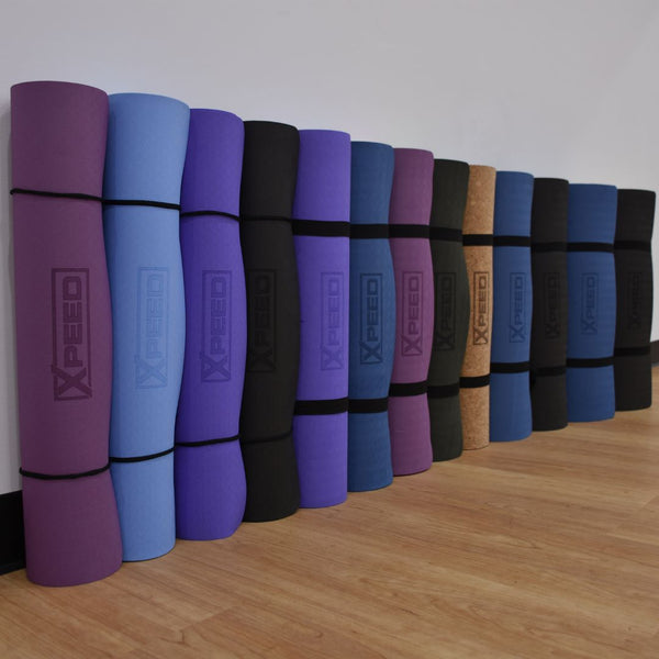 A group of xpeed yoga mats that vary in materials, thickness and type