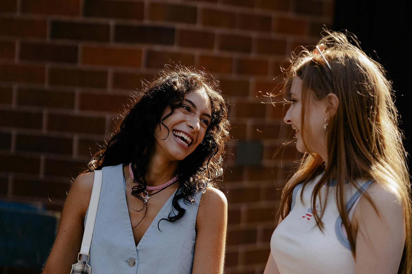 two women talking and laughing