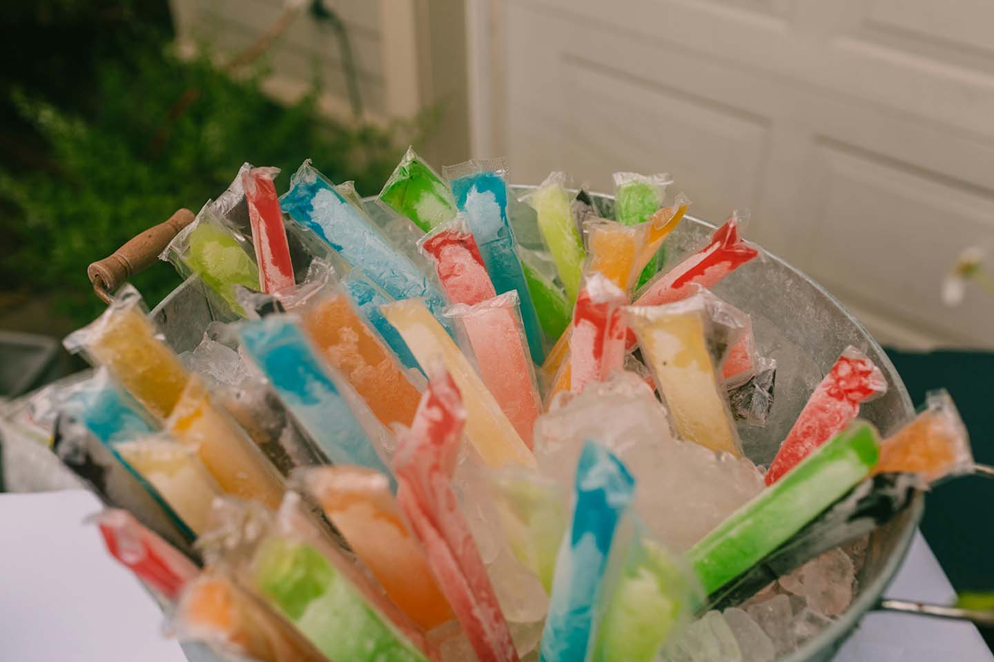 Bowl filled with colorful juice popsicles