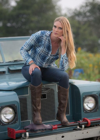 Model Gina Siebrandt strikes a pose on this vintage Land Rover at Sweet Berry Farm