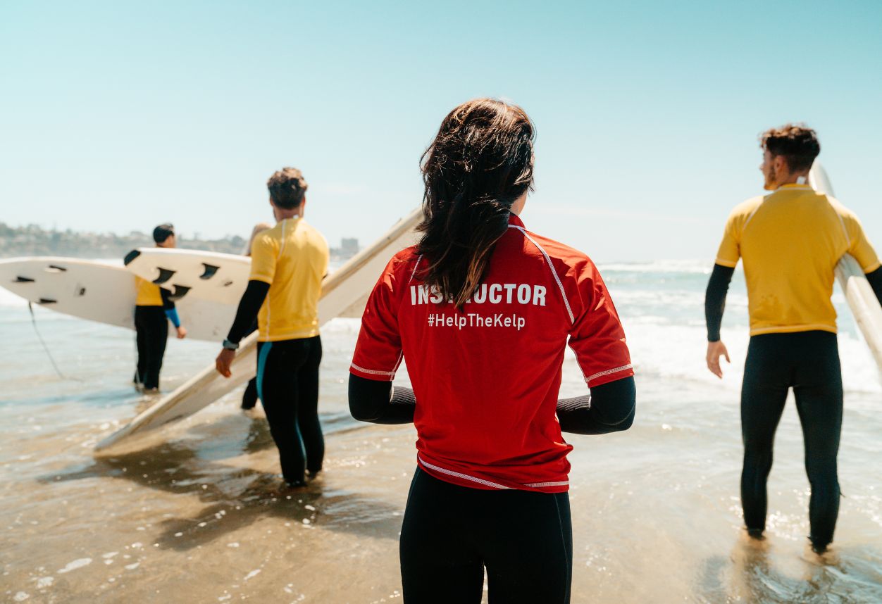 Everyday California surf instructor with customers
