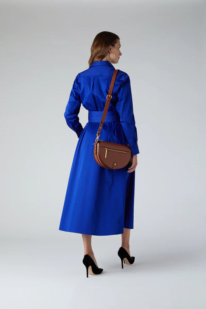 Blythe full skirt shirt dress in blue with Dahlia saddle bag in tan