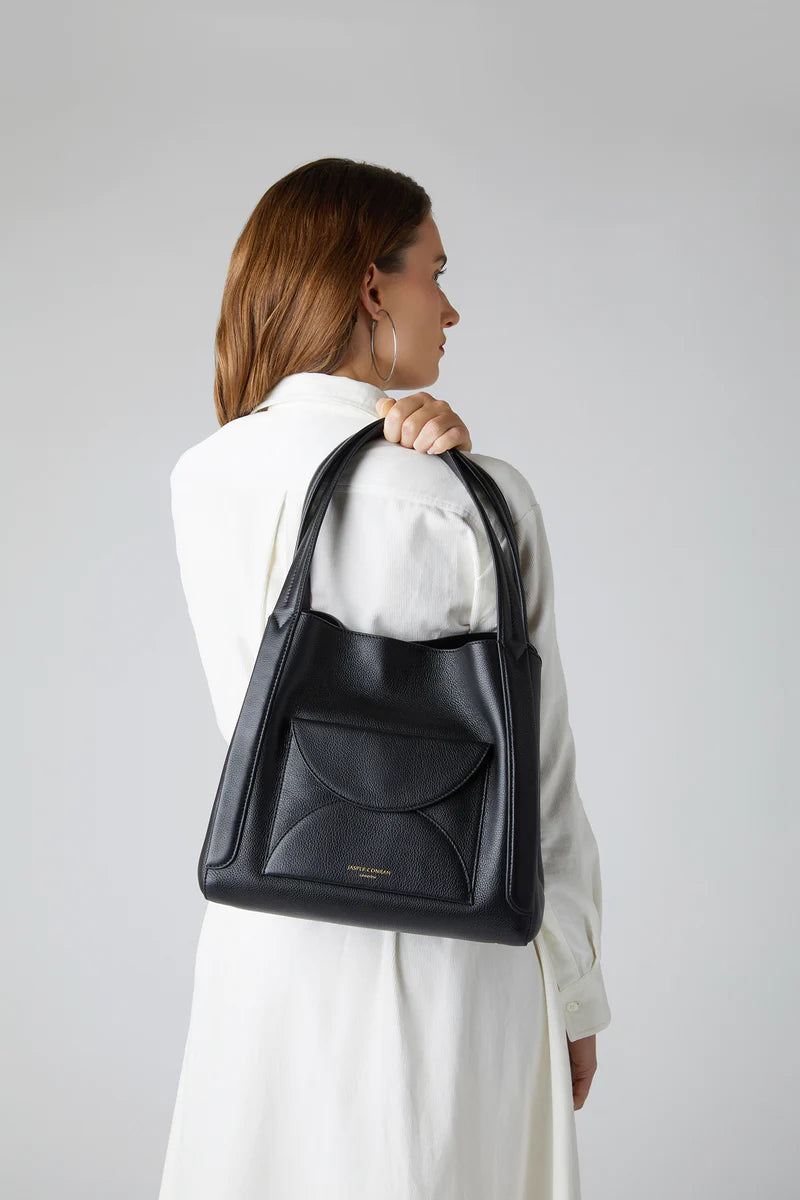 Darcey leather hobo bag in black (on the shoulder view)
