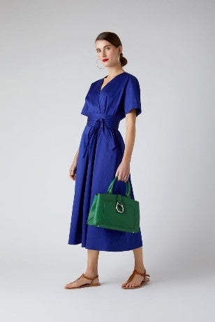 Betsy cotton wrap dress in blue with green mini tote bag