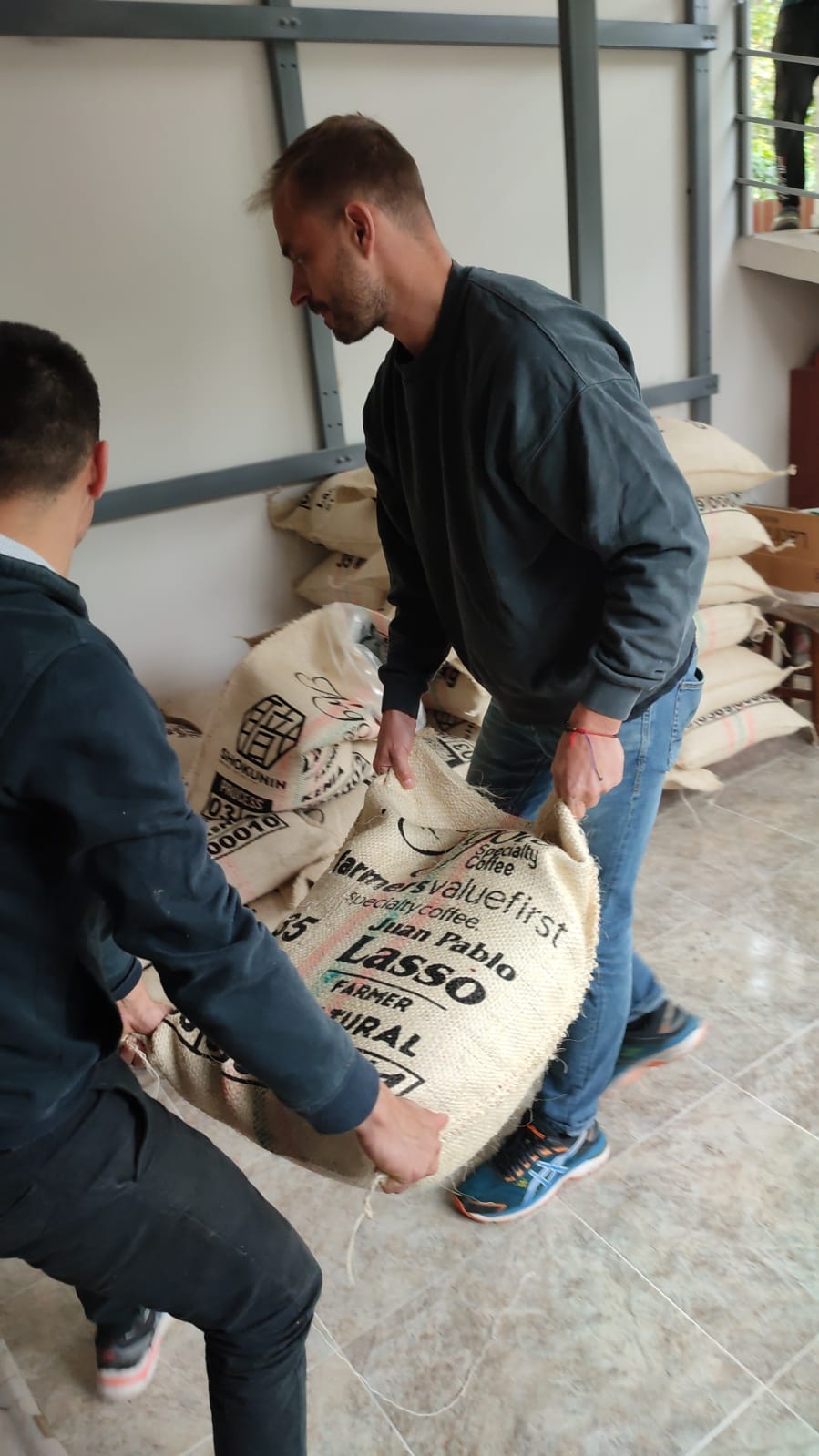Stacking coffee bags prepared for shipping.
