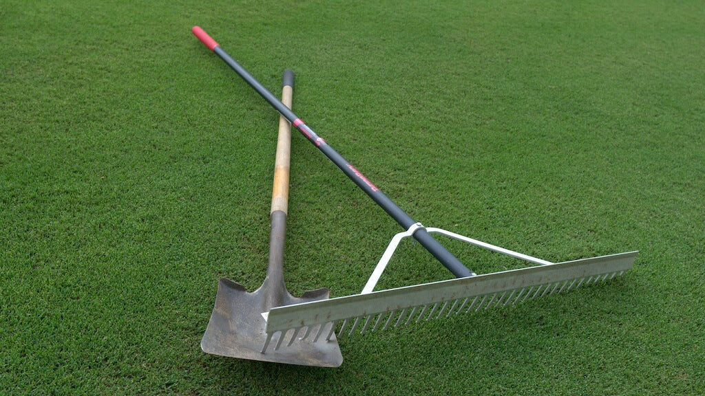 rake and shovel on lawn