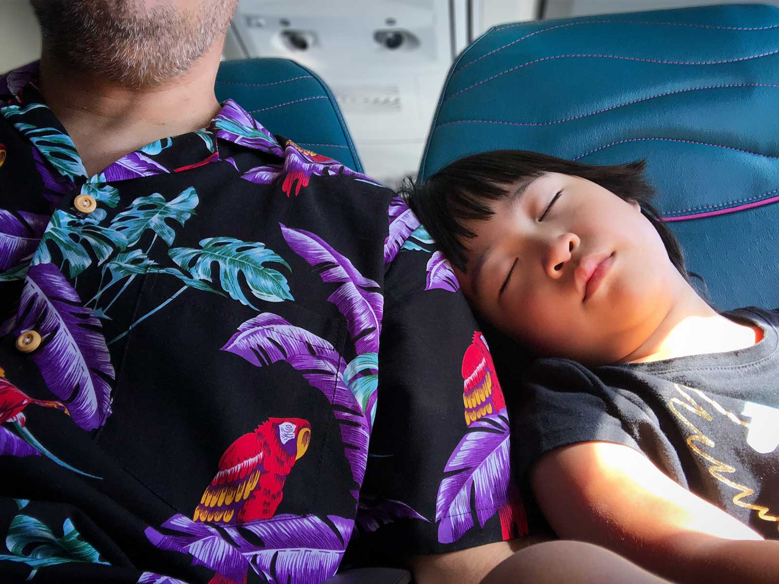 Sleeping in the plane after a trip to Hawaii