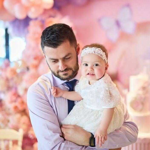 dad and her baby girl on her christening day