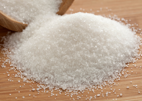 a large pile of sugar on a table.