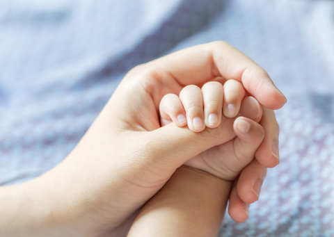 mom and baby hand