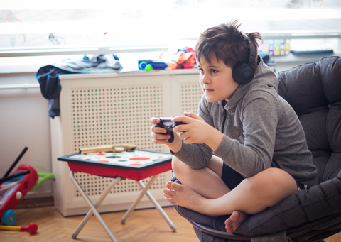 boy holding a gaming console