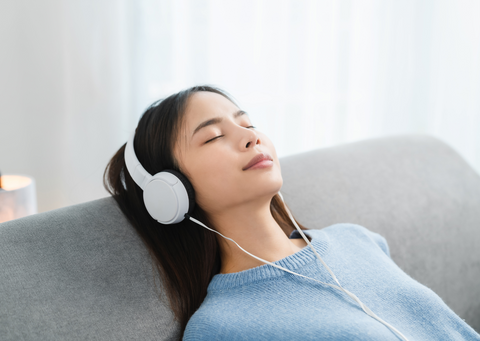 woman relaxing with headphones on