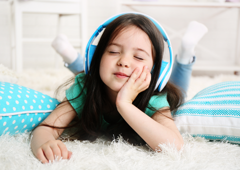 Little girl with headphones on