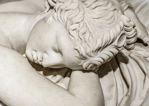 marble statue of a sleeping woman