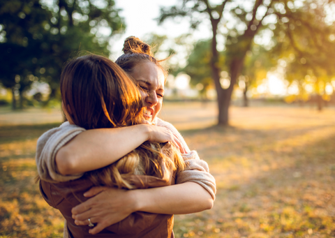 Two women hugging