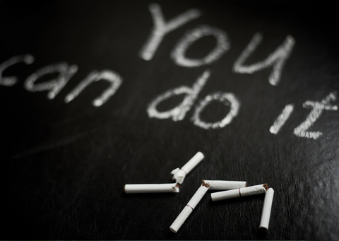 words saying you can do it, with some broken cigarettes on a black background