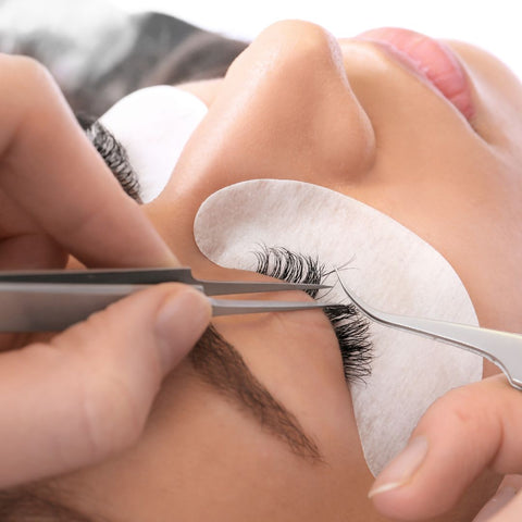 Woman getting eyelash extensions