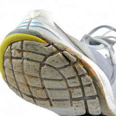 Shoe with worn outsole on medial side toe