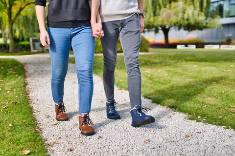 A couple walking through the park in Ahinsa barefoot shoes