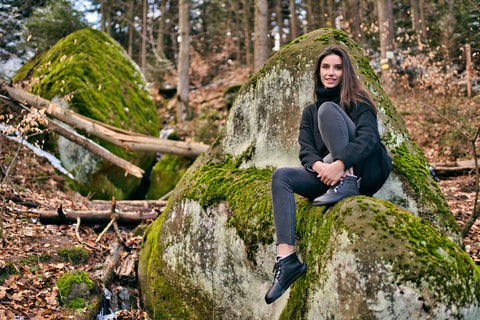 a woman in the forest in Ahinsa Sundara barefoot trekking shoes