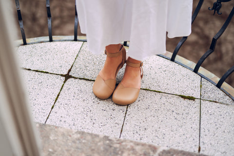 woman in beige Ahinsa sandals with zero drop