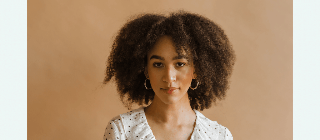 black woman with curly frizzy natural hair
