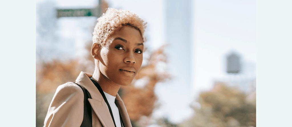 black woman with blond afro