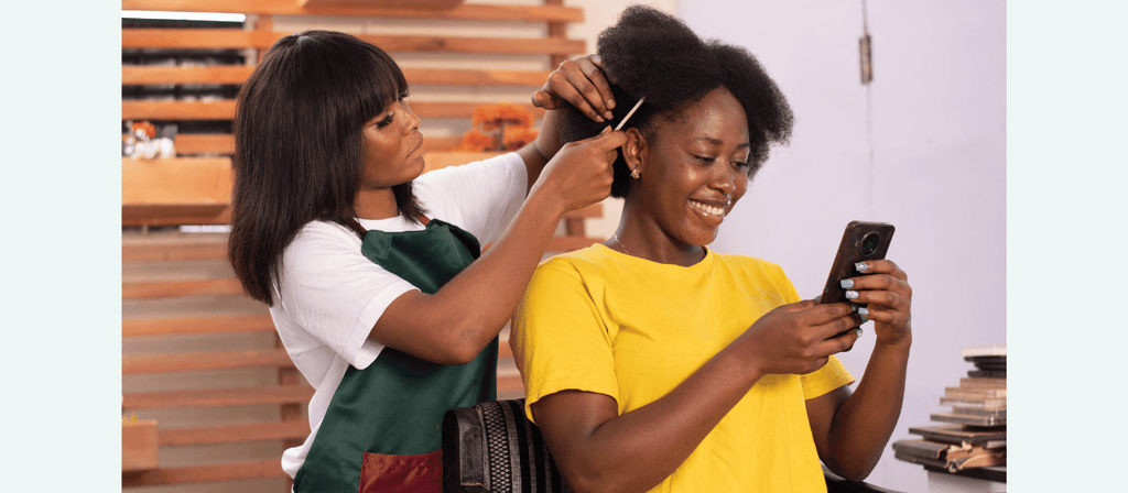 black woman gets natural hair consultation