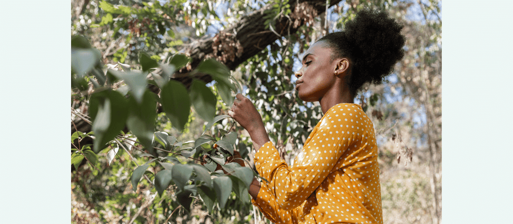 black woman with natural hair in humid climate