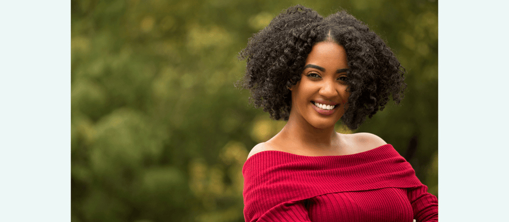 black woman has wash and go with damaged ends