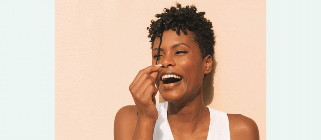 black woman uses ashwagandha for fast hair growth
