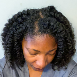 indara naturals repair and restore bundle results on woman with curly hair