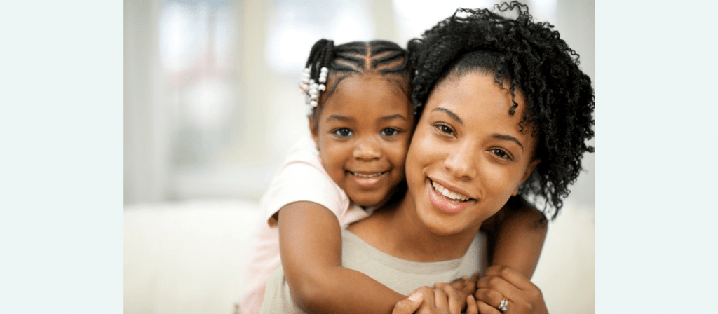 black woman and child prevent frizzy natural hair during summer