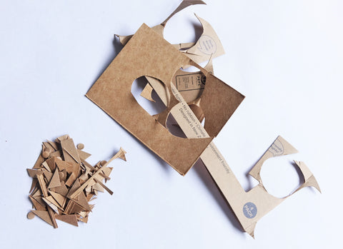 A pile of cardboard scraps on a white background