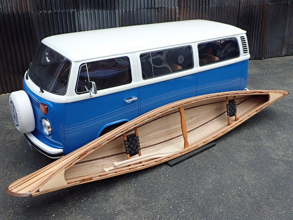 Scale model VW bus beside a scale model canoe