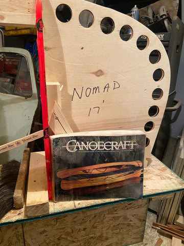 A copy of Canoecraft positioned in front of a Nomad 17 stem mold
