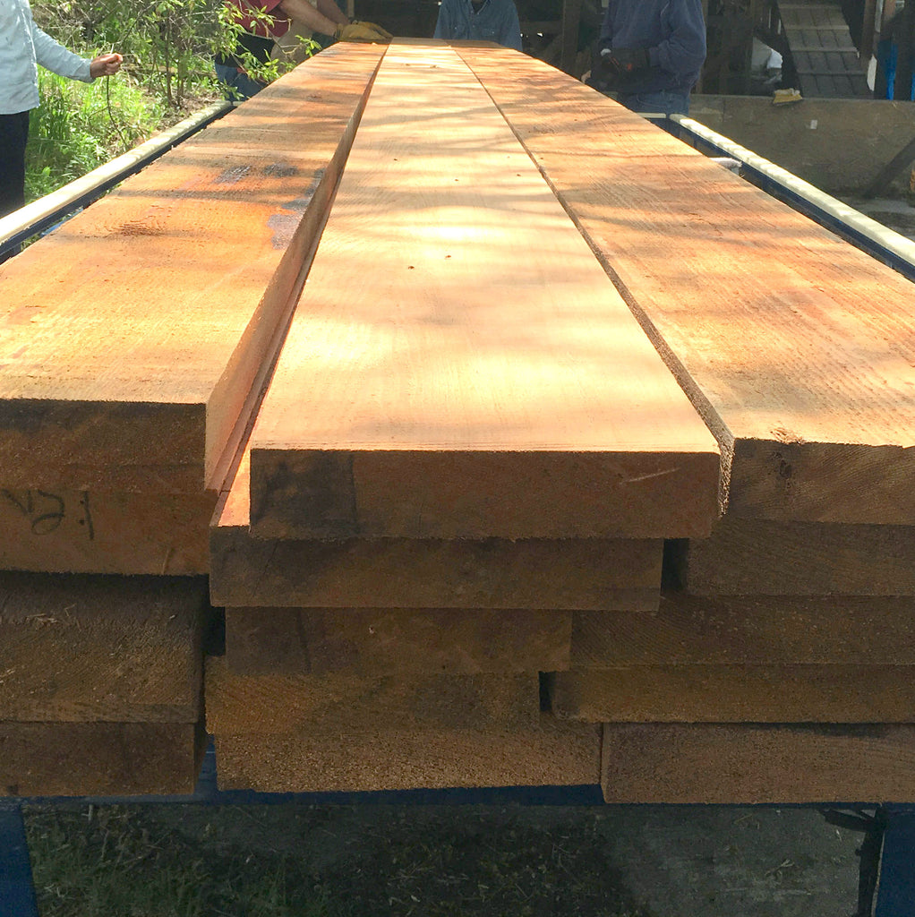 A pile of lumber to be milled into strips for canoes or kayaks