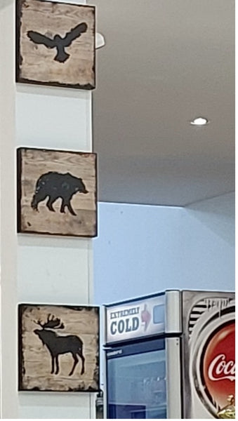 Silhouettes of wildlife framed in a café