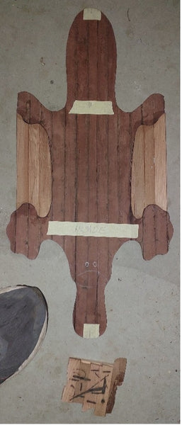 Wooden cutout of a platypus for a canoe inlay