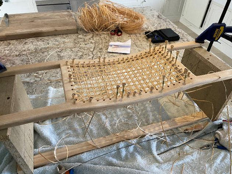 Canoe seats with cane weave partially finished