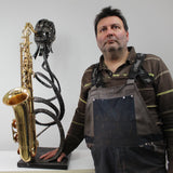 Skulptur Saxophonist von Philippe Buil Gesicht in Spitze Metall und Saxophon
