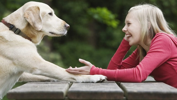 Girl talking to her pet dog