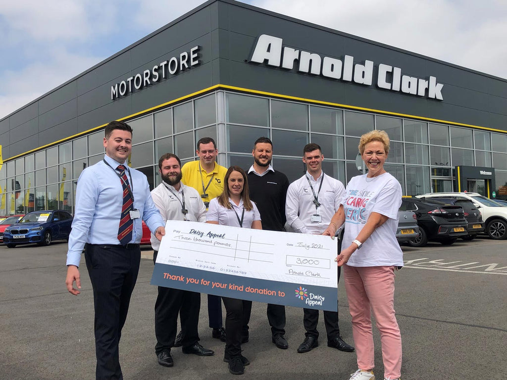 Claire Levy is pictured receiving a cheque for £3,000 from George Ferebee of Arnold Clark’s York Motorstore.