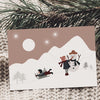 Postkarte "jouer dans la neige"