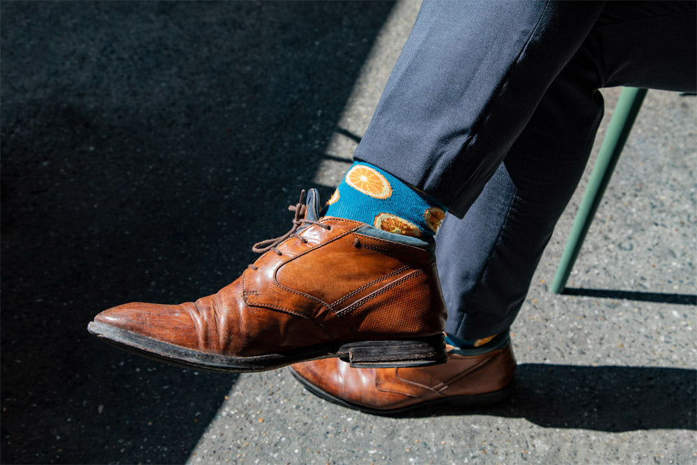 pair of dress shoes with printed socks