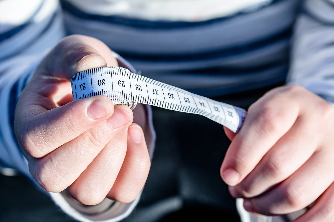 man holding tape measure