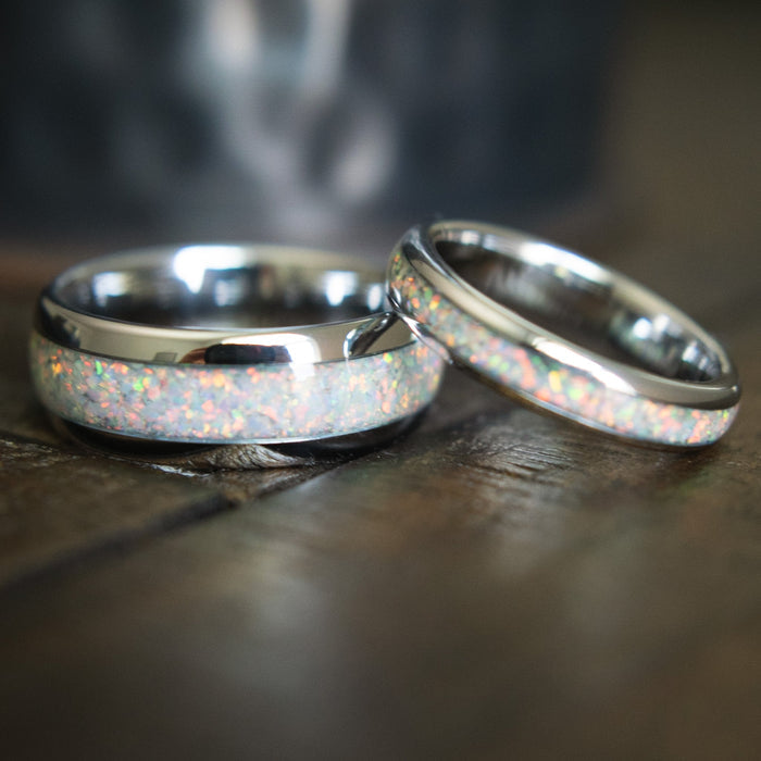 white gold tungsten and opal couples’ wedding bands