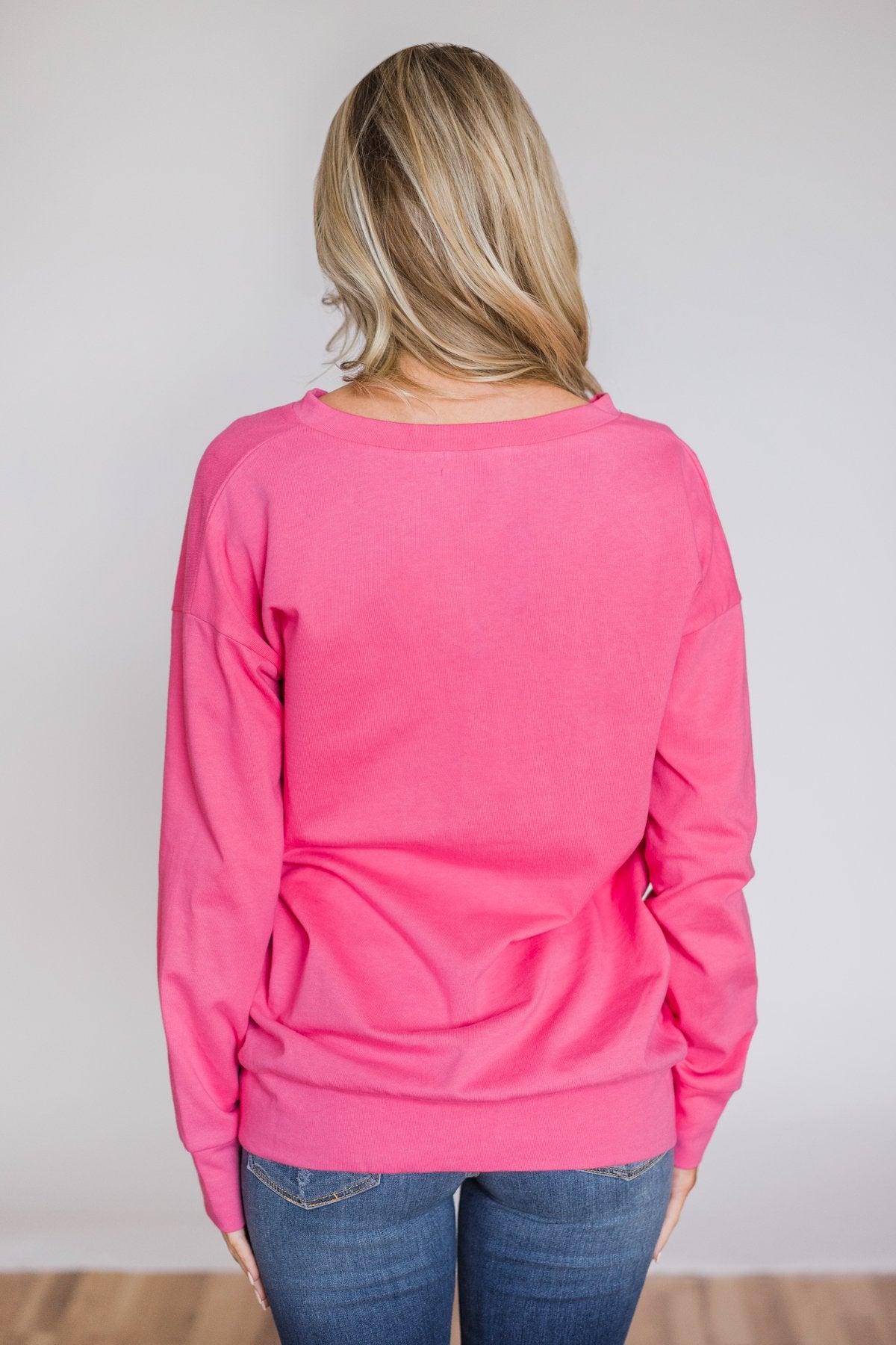 bright pink sweatshirt