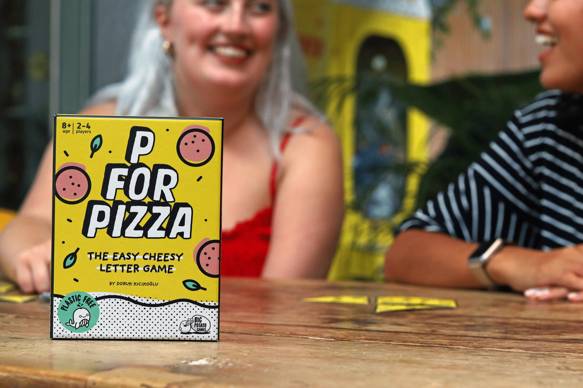 P for Pizza game box with woman in background