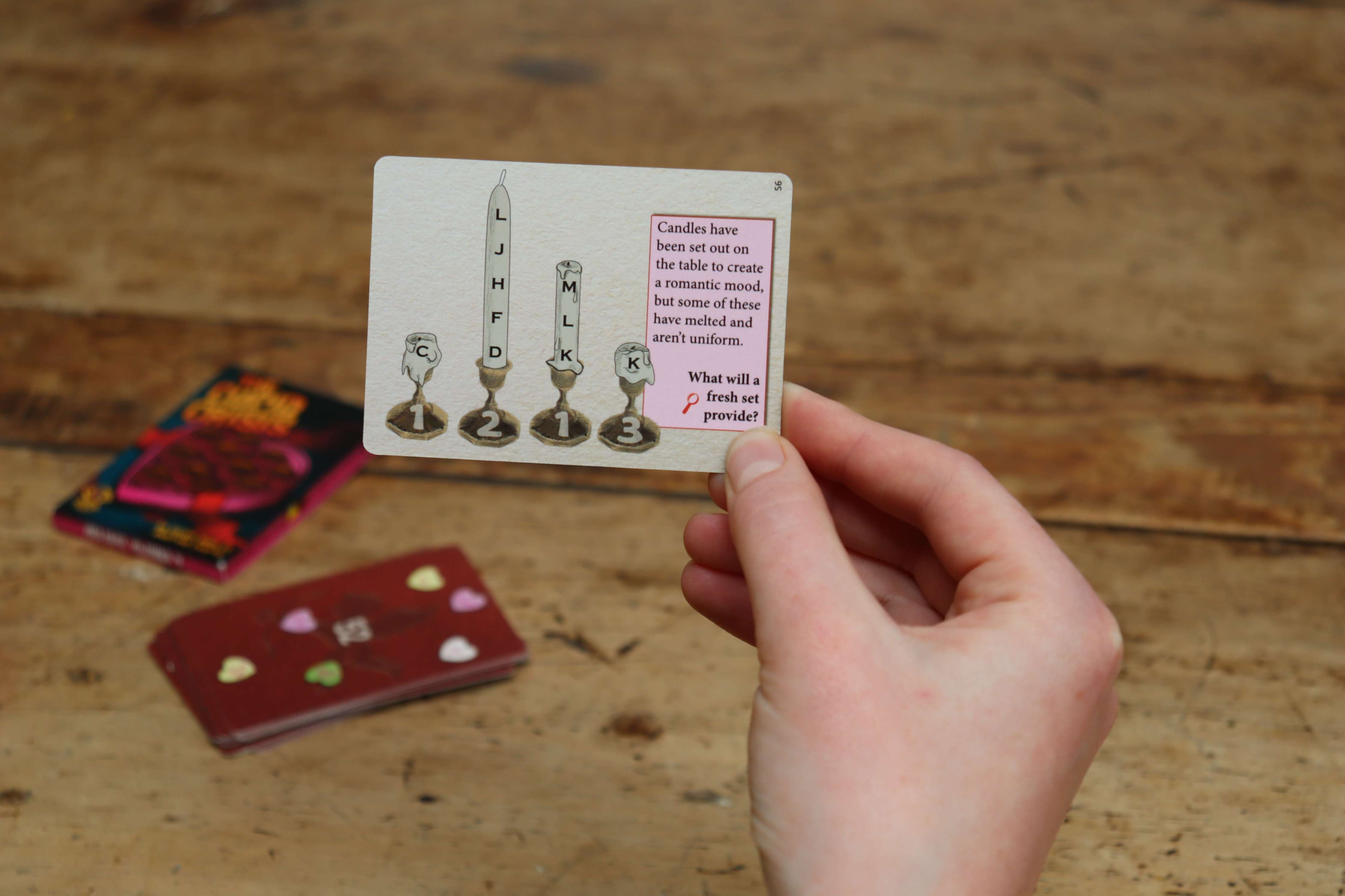 Hand holding Cupid Crisis card